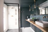 Bath Room, Wood Counter, Enclosed Shower, Corner Shower, Full Shower, Pendant Lighting, Concrete Wall, and Two Piece Toilet  Photo 9 of 17 in The Neon Flamingo by Spencer Sight