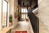The welcoming entryway features concrete aggregate flooring and custom fiber art from local artist Kate Crowley Gilbert.