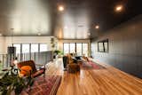 The expansive upstairs great room includes hidden floor to ceiling cabinets for storage, a reupholstered sectional and durable white oak floors. During the school year, Miranda also uses the space to homeschool the couple's seven children. 