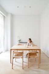 Soft White Walls, Linen Curtains, and White Oak Dining Room