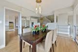 West Elm dining room light and a glimpse of that classic 1970's Harvest Gold colored double oven.