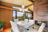 Fireplace, views, wood paneling and cinder-block wall