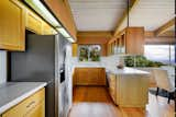 Quartz counters, subway tile backsplash and custom oak cabinetry