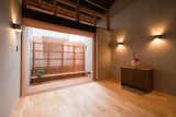 Living Room, Light Hardwood Floor, Storage, and Wall Lighting  Photo 2 of 10 in Ichijoji House by atelier Luke