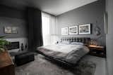 Bedroom, Bed, Dresser, Night Stands, Bench, Table Lighting, and Light Hardwood Floor  Photos from Marda Loop Residence