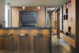 Kitchen, Wood Cabinet, Ceramic Tile Floor, and Granite Counter  Photo 7 of 11 in Downtown Penthouse by Shaun Ford & Co. 