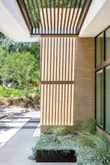 View of trellis at building entry.  Photo 7 of 12 in Inverse House by coxist studio