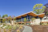 Outdoor, Front Yard, Grass, Walkways, Large Patio, Porch, Deck, Wood Patio, Porch, Deck, and Concrete Patio, Porch, Deck Eastern Elevation   Photo 1 of 8 in San Juan Island Modular by Fish Mackay Architects