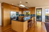 Chefs kitchen featuring teak cabinetry
