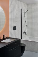 Bath Room, Concrete Floor, Undermount Sink, Drop In Tub, Wall Lighting, Mosaic Tile Wall, and One Piece Toilet  Photos from Favorites