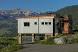 Exterior, House Building Type, Metal Siding Material, Stone Siding Material, and Shed RoofLine West Face on Approach  Photos