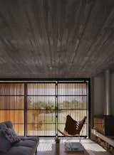 Living Room, Sofa, Chair, Ceiling Lighting, and Concrete Floor  Photo 15 of 31 in MARINDIA HOUSE by MASA Arquitectos