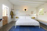 Bedroom, Bed, Bench, Wall Lighting, Shelves, Rug Floor, and Terrazzo Floor  Photo 6 of 10 in Do Malibu in Style With the Native Hotel, a Rejuvenated Hollywood Favorite