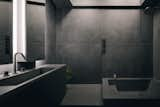 Christine wanted the bathroom to embrace darker hues and shadows. The architect credits Japanese novelist Jun'ichirō Tanizaki’s In Praise of Shadows as her reference for the space.