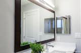 New sleek LED light and a large custom mirror brightened up the guest bath room.
 
Interior Design, Photos & Styling © Yoko Oda Interior Design, LLC