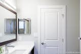 New sleek LED light and a large custom mirror brightened up the guest bath room.
 
Interior Design, Photos & Styling © Yoko Oda Interior Design, LLC