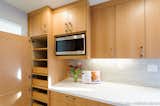 There was no pantry before. New custom cabinetry with a lot of pullouts becomes a pantry for the new kitchen. A new microwave has a home off the counter. 

Interior Design, Photos & Styling © Yoko Oda Interior Design, LLC