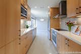 We raised the drop ceiling and removed the crown molding to emphasize the clean lines of this newly renovated kitchen. 

Interior Design, Photos & Styling © Yoko Oda Interior Design, LLC