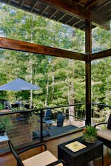 An extra tall ceiling in the screen porch is to catch the breezes and help keep the porch cool in the hot NC climate.