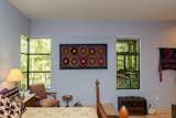 Tribal textiles adorn the Professor's Master Bedroom, which is painted her favorite shade of pale periwinkle.