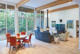 The living and dining areas are adjacent to the porch with its deeply cantilevered roof, encouraging outside living all year long.