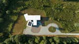 An aerial view shows the house footprint, it's white "cool roof" membrane and the solar array that lets us hit net zero.