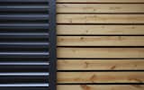 Galvalume and wood cladding compliment one another to shelter the exterior.