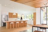 Kitchen, Engineered Quartz, Wood, White, Light Hardwood, Concrete, Ceramic Tile, Ceiling, Refrigerator, Undermount, and Range  Kitchen Concrete Light Hardwood Photos from Northern Lake Home