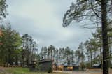 Exterior, Cabin Building Type, House Building Type, Metal Roof Material, Wood Siding Material, Concrete Siding Material, Metal Siding Material, Stone Siding Material, Flat RoofLine, and Shed RoofLine  Photo 18 of 20 in Northern Lake Home by Strand Design