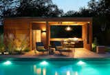Outdoor, Grass, Front Yard, Trees, Hardscapes, Large Pools, Tubs, Shower, Swimming Pools, Tubs, Shower, Concrete Pools, Tubs, Shower, Wood Patio, Porch, Deck, Decking Patio, Porch, Deck, Landscape Lighting, and Hanging Lighting  Photos from Theodore Wirth Ranch