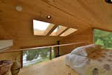 Bedroom, Bed, Recessed Lighting, and Medium Hardwood Floor  Photo 10 of 11 in Sleep in This Romantic Tree House Just Outside NYC