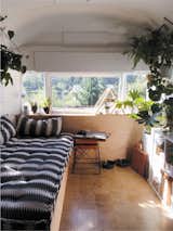 After purchasing a dilapidated 1971 Airstream Sovereign for less than $5,000, Seattle-based couple Natasha Lawyer and Brett Bashaw overhauled the 200-square-foot trailer for approximately $22,000. The daybed area in the front of the Airstream transitions into a small kitchen and bathroom, while a sleeping area with a king-size bed occupies the rear.