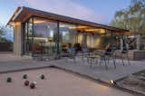 Outdoor, Landscape Lighting, Back Yard, Concrete Patio, Porch, Deck, Boulders, and Desert  Photo 6 of 12 in An Old Horse Barn Is Repurposed as a Chic Desert Guesthouse