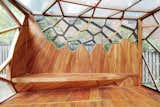Living Room, Medium Hardwood Floor, and Bench  Photos from This Prefab Backyard Pavilion Mimics a Dragonfly's Wings
