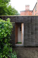 Shed & Studio and Living Space Room Type The hidden entrance slides open.  Photos from A Quirky Micro-Office Hides Behind a “Hairy” Facade