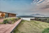 The home is set on the top of a hill for prime views.