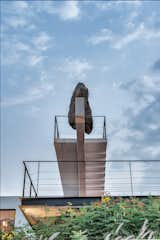 Exterior, House Building Type, Stucco Siding Material, and Flat RoofLine The precariously perched rock weighs four tons, which is roughly the same weight as an adult Indian elephant.

  Photo 3 of 14 in A Modern Home in India Evokes Emotion With a Giant 4-Ton Rock