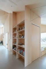 Storage Room and Shelves Storage Type Transom glass above each door allows for light and views while reducing sound transmission.  Photo 8 of 14 in A Pinwheel-Shaped Cabin in Norway Is a Fresh Take on the Traditional Hytte