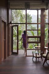 Doors, Folding Door Type, Wood, and Exterior Floor-to-ceiling wood-framed glazing frames views of the outdoors.   Photo 5 of 11 in These Perched Cabins in India Will Stimulate All Your Senses