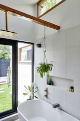 Wood Melbourne supplied the Otis timber and brass shower head.