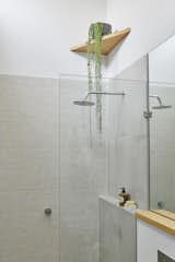 Bath Room, Open Shower, and Corner Shower The Caroma shower head meets the highest level of Water Efficiency Labelling and Standards (WELS) at three stars.

  Photo 8 of 13 in An Old Worker’s Cottage Is Reborn Into an Eco-Friendly Home and Learning Center