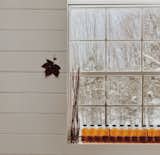Windows and Single Hung Window Type Bottled maple syrup line the windowsill in the couple's new pottery studio.   Photo 6 of 14 in A Couple Transform a Prefab Shed Into a Cozy Cabin in Less Than Two Months