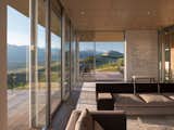 Full-height glazing wraps around the living spaces, which overlook the expansive Wyoming landscape.