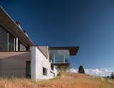 Exterior, Metal Roof Material, Metal Siding Material, Wood Siding Material, House Building Type, Concrete Siding Material, Flat RoofLine, and Green Roof Material Exposed concrete walls provide thermal mass and protection from wildland fires.

  Photos from A Modern House Accentuates a Sensational Wyoming Landscape