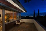 Outdoor, Trees, Small Patio, Porch, Deck, Shrubs, and Stone Patio, Porch, Deck The flagstone patio overlooks city views.  Photo 15 of 15 in Calling All Richard Neutra Fans—His Bonnet House in L.A. Hits the Market at $1.8M