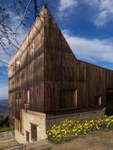 Exterior, House Building Type, Wood Siding Material, and Stone Siding Material The band of glazing separates the timber cladding from the stone base.

  Photos from Experience Boundless Himalayan Views in This Modern Mountain Retreat