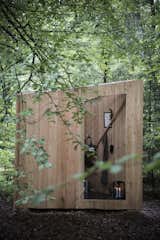 Composting toilets are housed in the outhouses designed and built by Flemming and Thorbjørn Flegal using larch, slate, and glass.