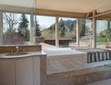 The master bathroom offers unobstructed views of the Flatirons.