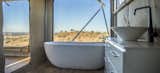 Bath Room, Freestanding Tub, Medium Hardwood Floor, and Vessel Sink The interior freestanding bath in the Uralla.  Photo 10 of 11 in Escape to the Australian Bush in Style With These Eco-Friendly, Luxe Tents
