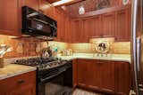 Dexter Builders remodeled the kitchen in 2006, which includes updates like custom cabinetry, new appliances, and granite countertops.